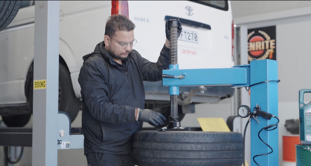 Auto Surgeons mechanic fitting a tyre